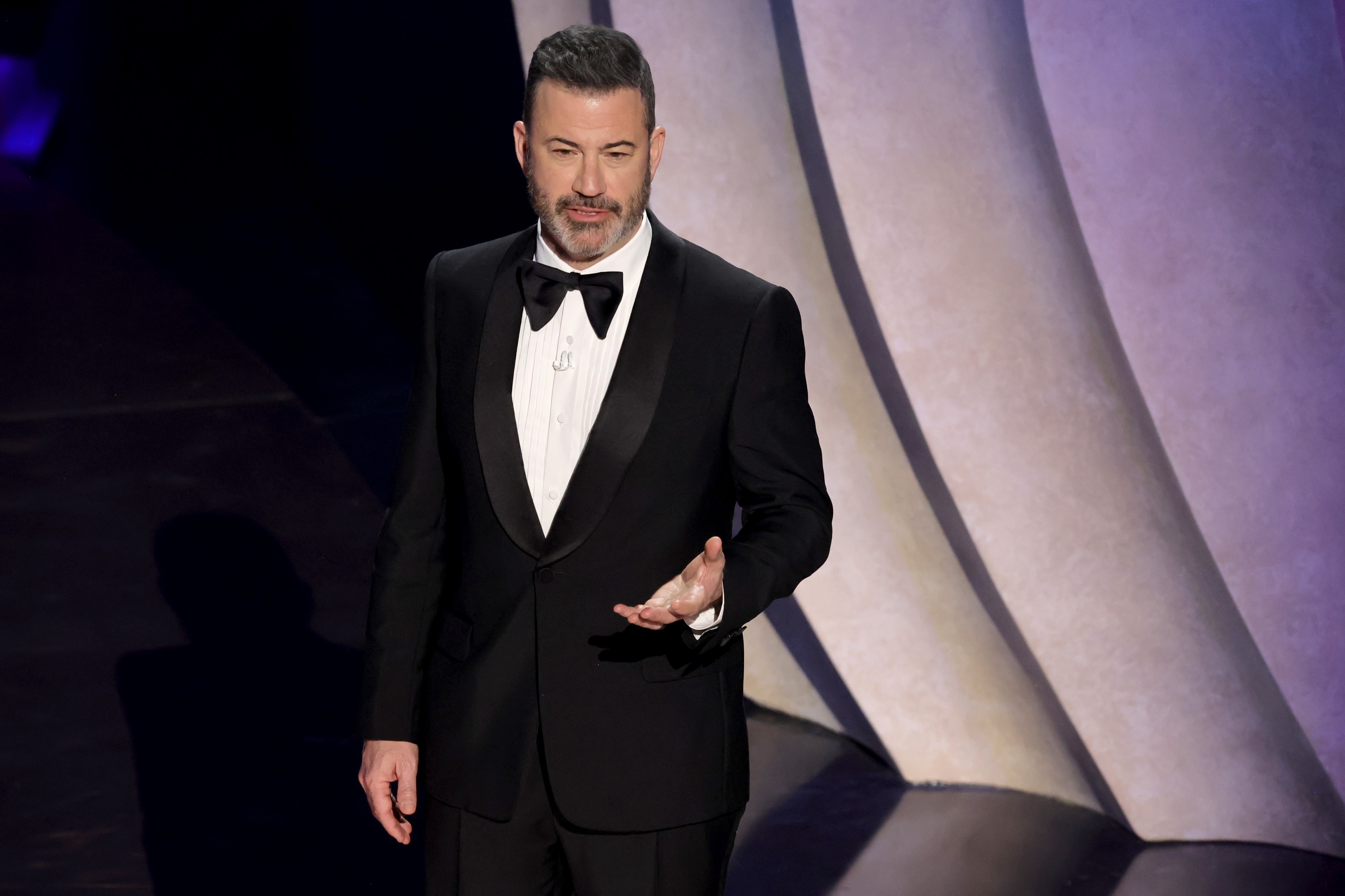 Jimmy Kimmel speaks onstage while hosting the 96th Annual Academy Awards in March 2024. Labor unions, free speech groups and fellow entertainers are rallying around him after ABC suspended his late-night show on Wednesday.