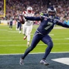 Seattle Seahawks linebacker Uchenna Nwosu (7) celebrates his touchdown on a fumble recovery during the second half of the NFL Super Bowl 60 football game against the New England Patriots, Sunday, Feb. 8, 2026, in Santa Clara, Calif.