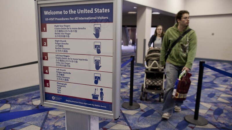 Passengers from an international flight enter customs and immigration control at McCarran International Airport. the Department of Homeland Security is proposing collecting social media information from tourists visiting from countries that don't require a visa. 