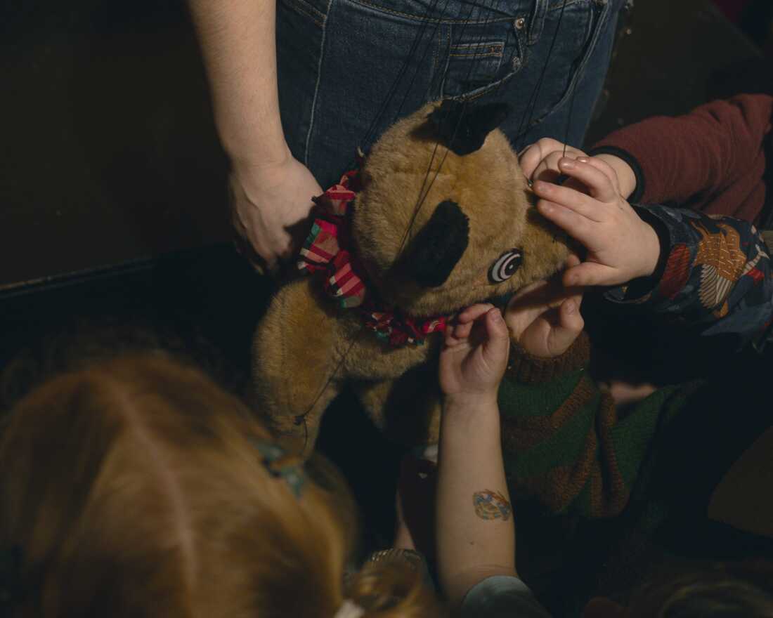 Children meeting and seeing up close one of the puppets in "The Steadfast Tin Soldier" after the show.