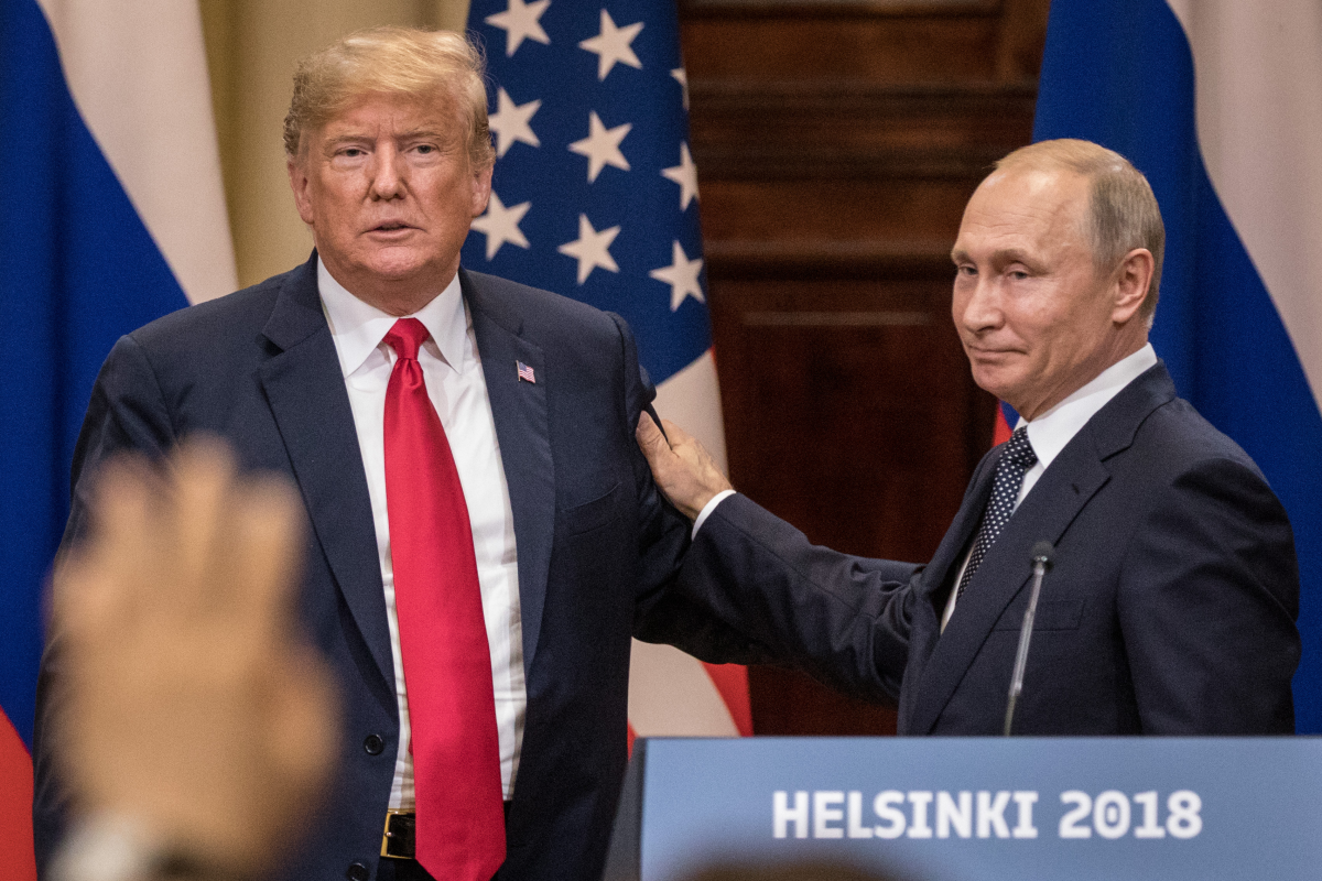 President Trump and Russian President Vladimir Putin shake hands during a joint press conference on July 16, 2018 in Helsinki, Finland.