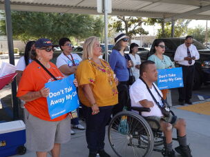 A protest outside U.S. Rep. David Valadao's district office in Bakersfield, California focused on healthcare costs and the congressman's vote last year to cut Medicaid. Bakersfield resident Ulises Hernandez uses a wheelchair and fears the cuts will lead to even longer wait times for care.