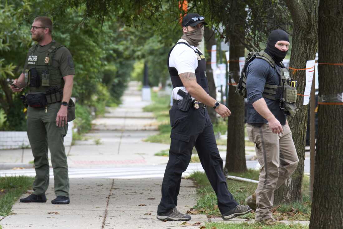 Armed officers from several federal agencies 