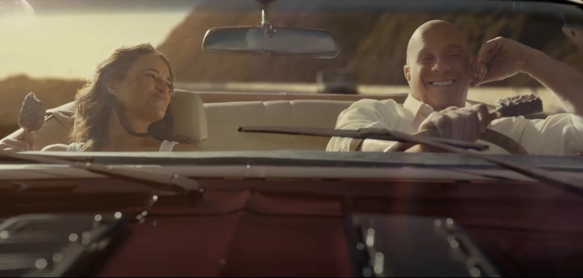 A screenshot from Häagen-Dazs' first Super Bowl commercial 'Not so fast, not so furious' featuring Michelle Rodriguez (left), Vin Diesel (right) and Ludacris (not shown) reprising their roles from the Fast & Furious franchise.