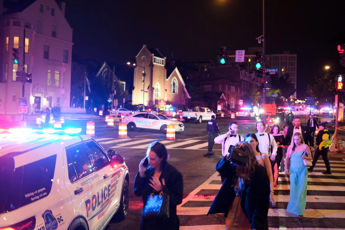 Guests depart the Washington Hilton amid a heavy police presence on Saturday night.