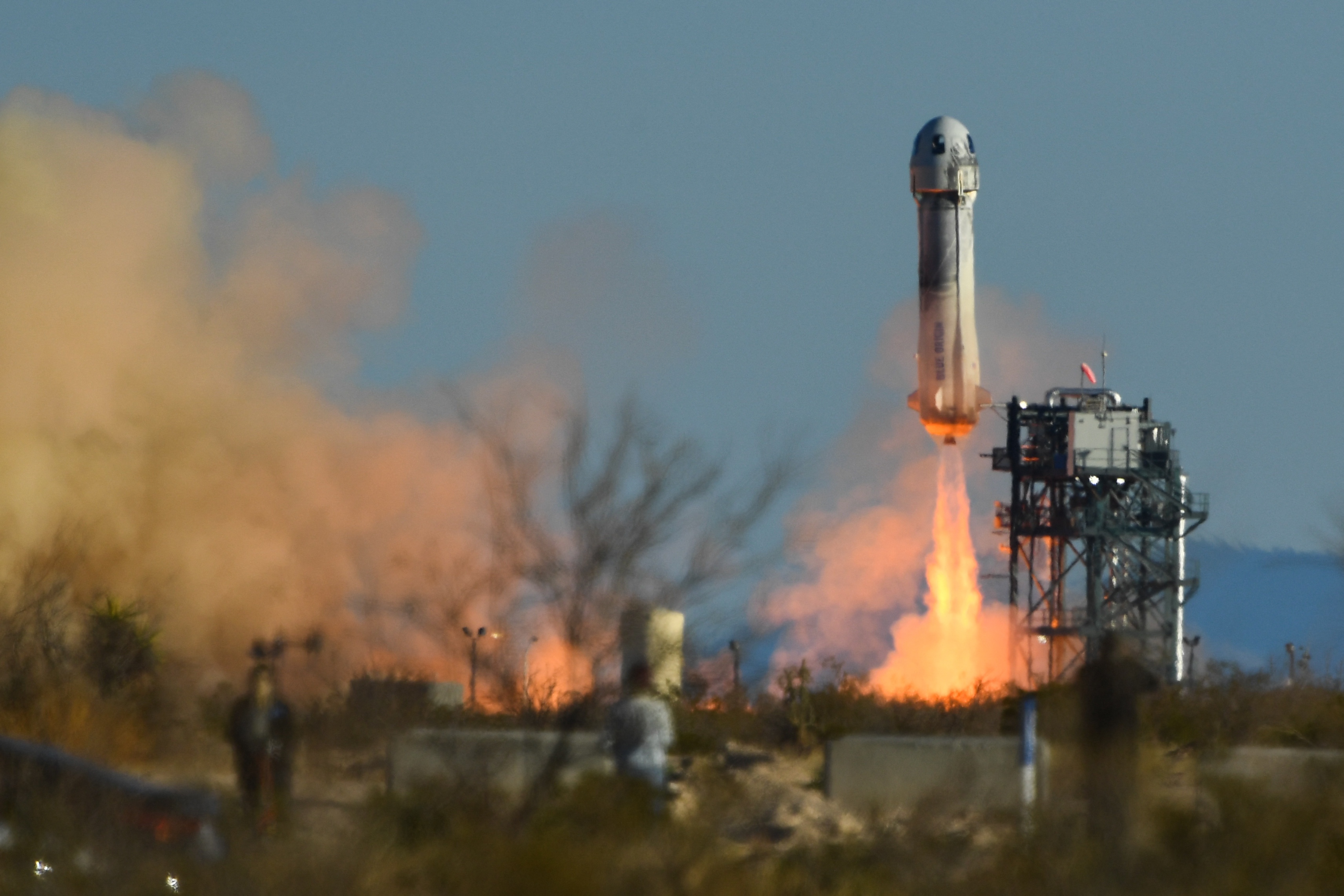 A Blue Origin New Shepard rocket launches from West Texas on March 31, 2022. Blue Origin has announced its stopping human space launches for at least two years as it focuses on helping NASA return humans to the moon.