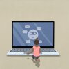 A stock illustration of a girl sitting in front of an oversized laptop with a cartoon face with message bubbles on the screen.
