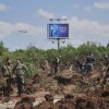 Israeli security forces inspect the site where the Israeli military said a projectile fired by Yemen's Houthi rebels landed in the area of Ben Gurion International Airport near Tel Aviv, Israel, on Sunday, May 4, 2025.