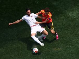 Iran's Alireza Jahanbakhsh is challenged by Belgium's Maxim De Cuyper during the 2026 World Cup match between Belgium and Iran on June 21 in Inglewood, Calif.