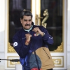 President of Venezuela Nicolás Maduro dances during a march as part of the