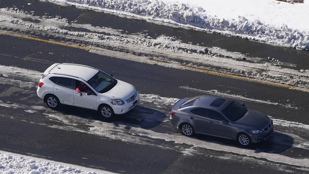 Stranded motorists wait for a tow on Interstate 95 in 2022 in Ladysmith, Virginia. A massive winter storm closed about 48 miles of the interstate. (AP)