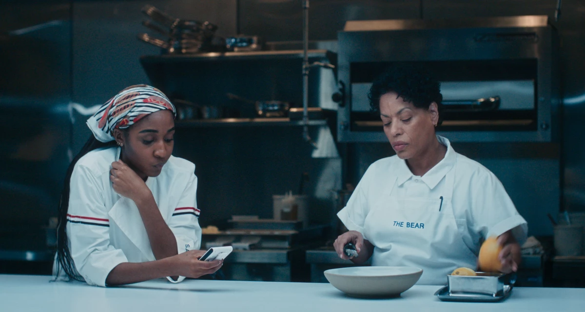 Ayo Edebiri as Sydney Adamu and Liza Colón-Zayas as Tina Marrero.