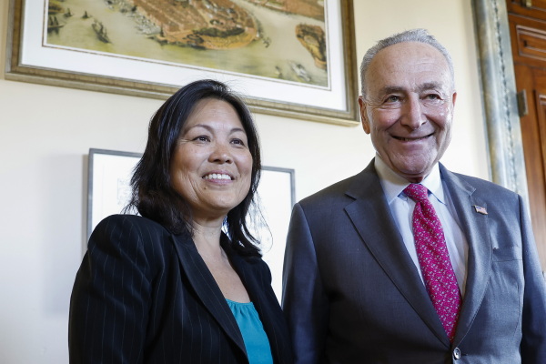 Senate Majority Leader poses for a photo with Julie Su, U.S. President Joe Biden's nominee to be the next Secretary of Labor, in his office at the U.S. Capitol Building on March 28, 2023 in Washington, DC. Su previously served as the Deputy Secretary of Labor. (Photo by Anna Moneymaker/Getty Images)
