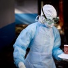 Marburg is an incredibly deadly virus. An outbreak in Rwanda is being handled with an "unprecedented" rate of success, say public health experts. In this photo from a 2014 outbreak in Kenya, a medical worker in protective gear carries a meal to a man quarantined in an isolation tent after coming into contact in Uganda with a Marburg carrier.