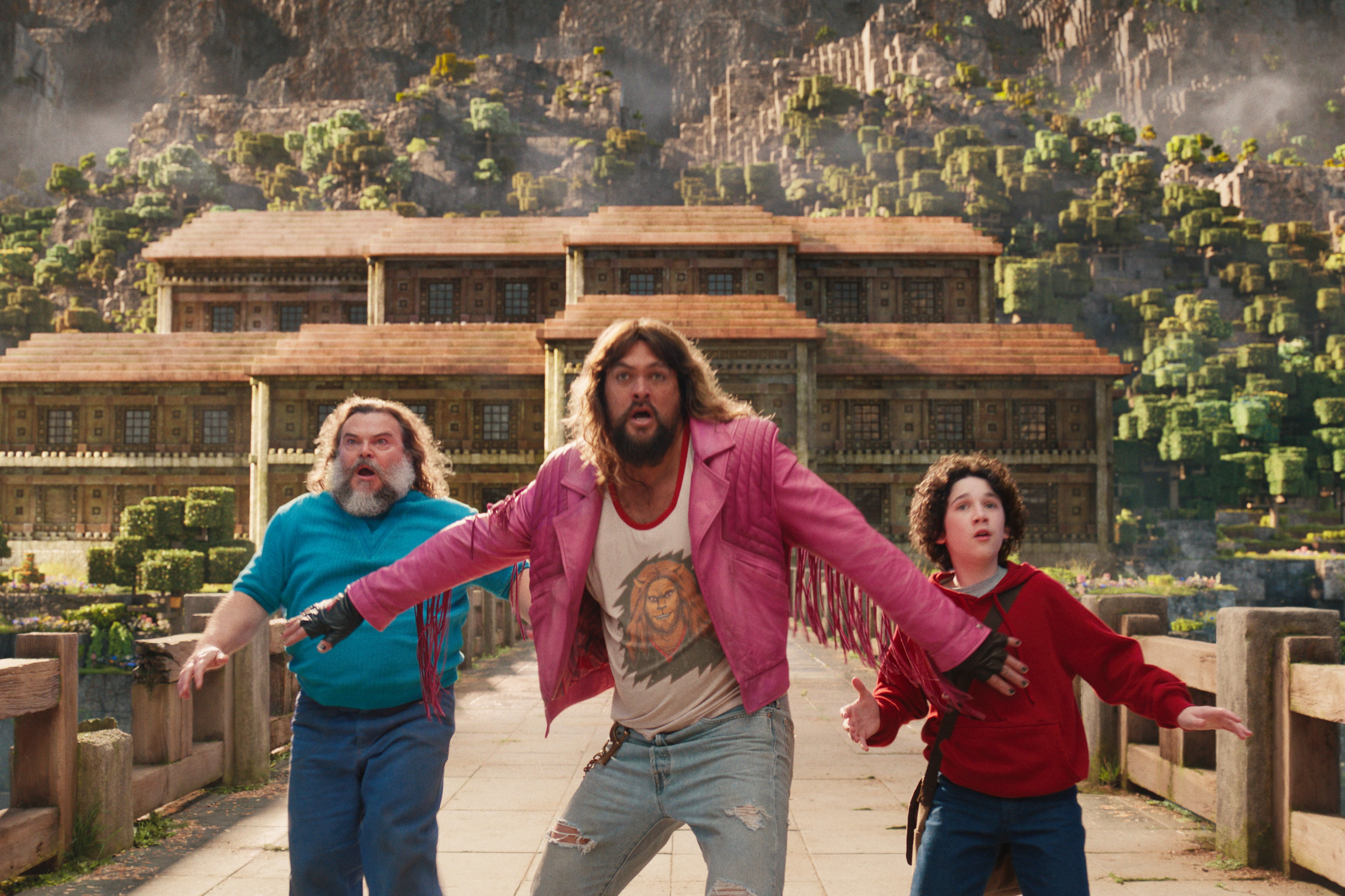 Jack Black as Steve, Jason Momoa as Garrett and Sebastian Hansen as Henry in <em>A Minecraft Movie</em>, out Friday.