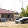 A hearse and van sit outside the Return to Nature Funeral Home in Penrose, Colo., on Oct. 6, 2023.