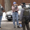 Observers film ICE agents in Minneapolis in February. A new lawsuit alleges that the federal government is trying to intimidate observers who monitor immigration enforcement operations.
