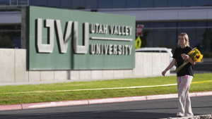 Meagan Bradley walks to a memorial for Charlie Kirk at Utah Valley University in Orem, Utah, Friday, Sept. 12, 2025. (AP Photo/Lindsey Wasson)