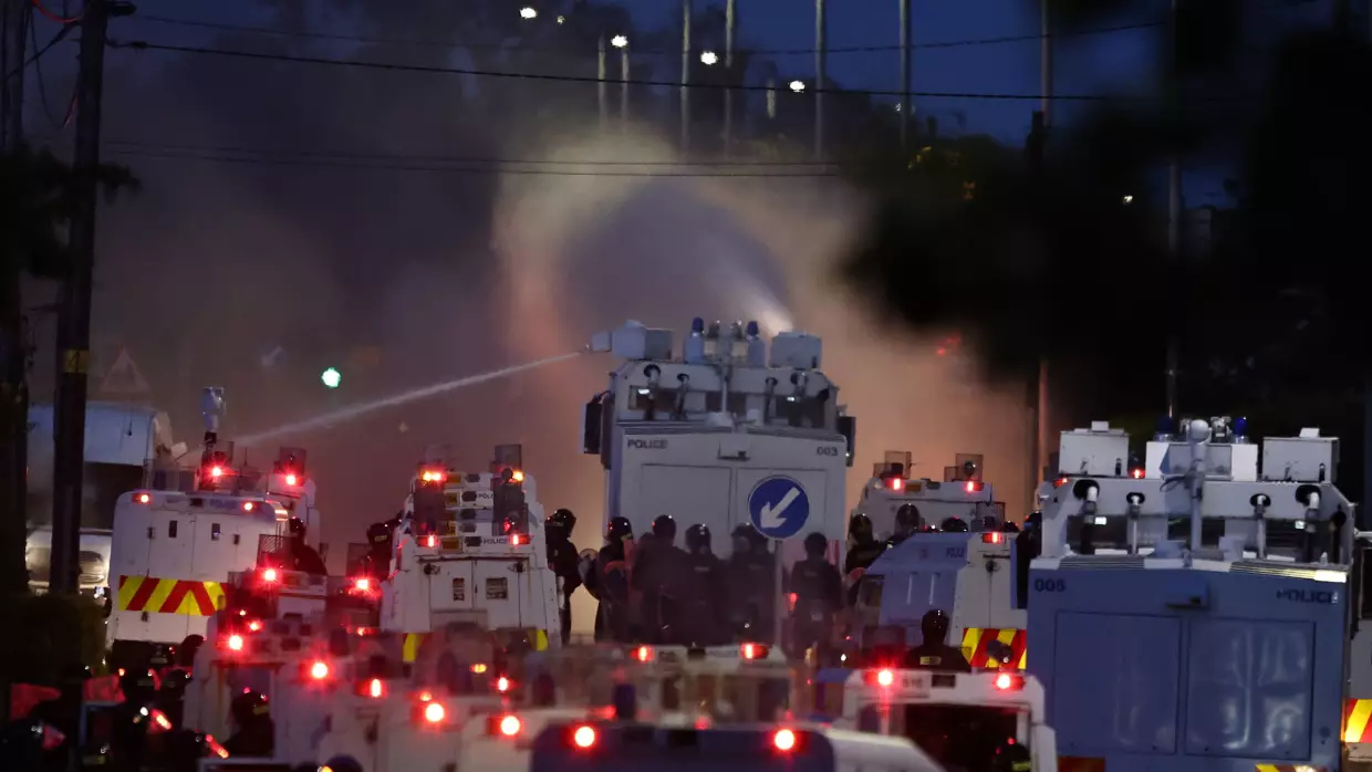 Police blast water cannons at protesters amid unrest over stabbing in Belfast