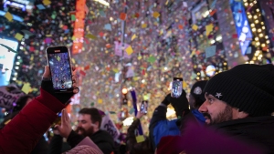 Revelers celebrate after the ball drops in New York's Times Square, Wednesday, Jan. 1, 2025, in New York.