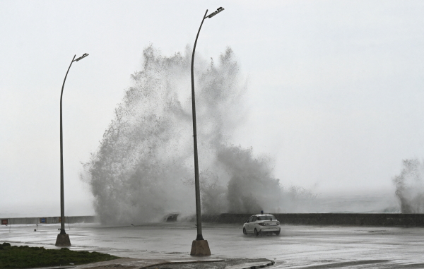 Waves crash against the Malecon promenade in Havana as Hurricane Milton churns in the Gulf of Mexico on Wednesday.
