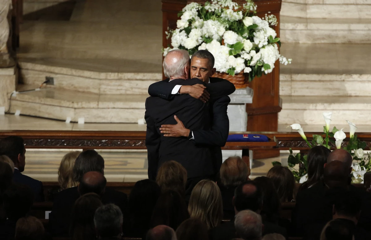 President Obama hugs Vice President Biden during funeral services for Biden's son Beau in Wilmington, Del., on June 6, 2015.