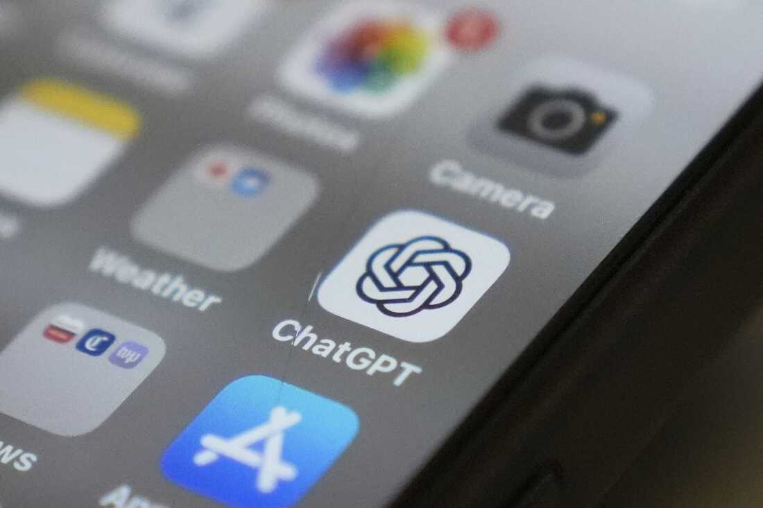 A cellphone screen is shown with the ChatGPT app icon in focus. 