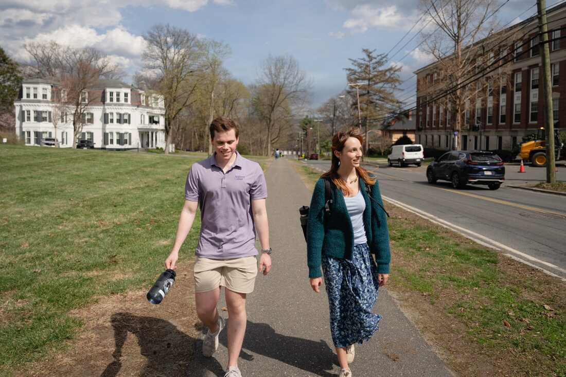 Students Ryan Peipher and Kara Lewis, upperclassmen who both come from rural areas, walk on the Amherst College campus. “Once you do get away, you experience how special it was to grow up in that small town, and also the impact you can have,” says Peipher.