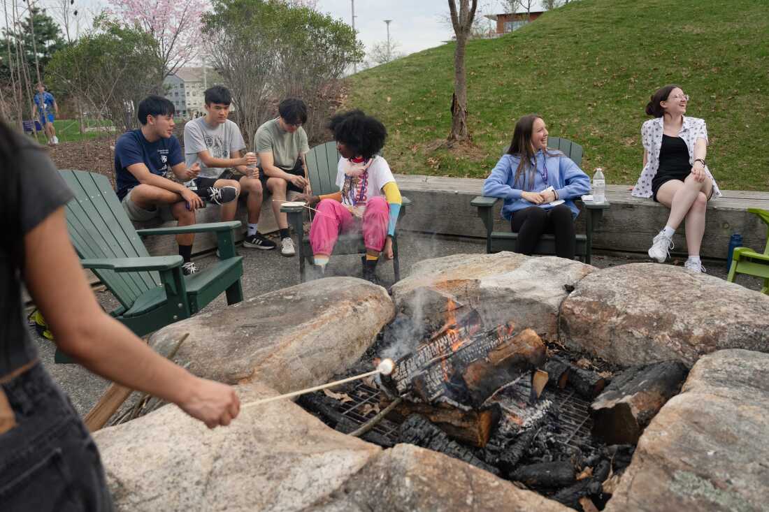 Students and prospective students from rural areas make s’mores around a fire pit at Amherst College, during a visit for accepted applicants still weighing their enrollment decisions.