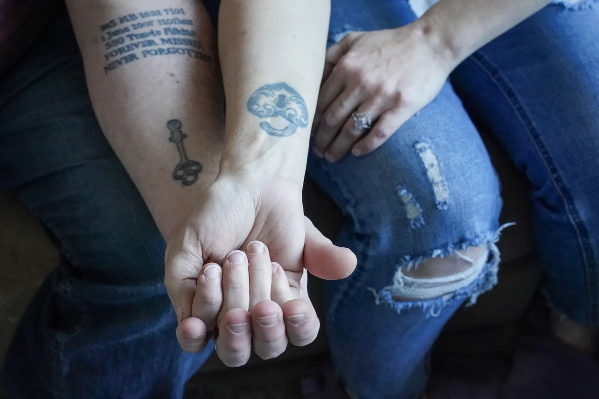 Kevin and Jenny Conlon show their lock and key tattoos, as well as Kevin's tribute to a fallen comrade.