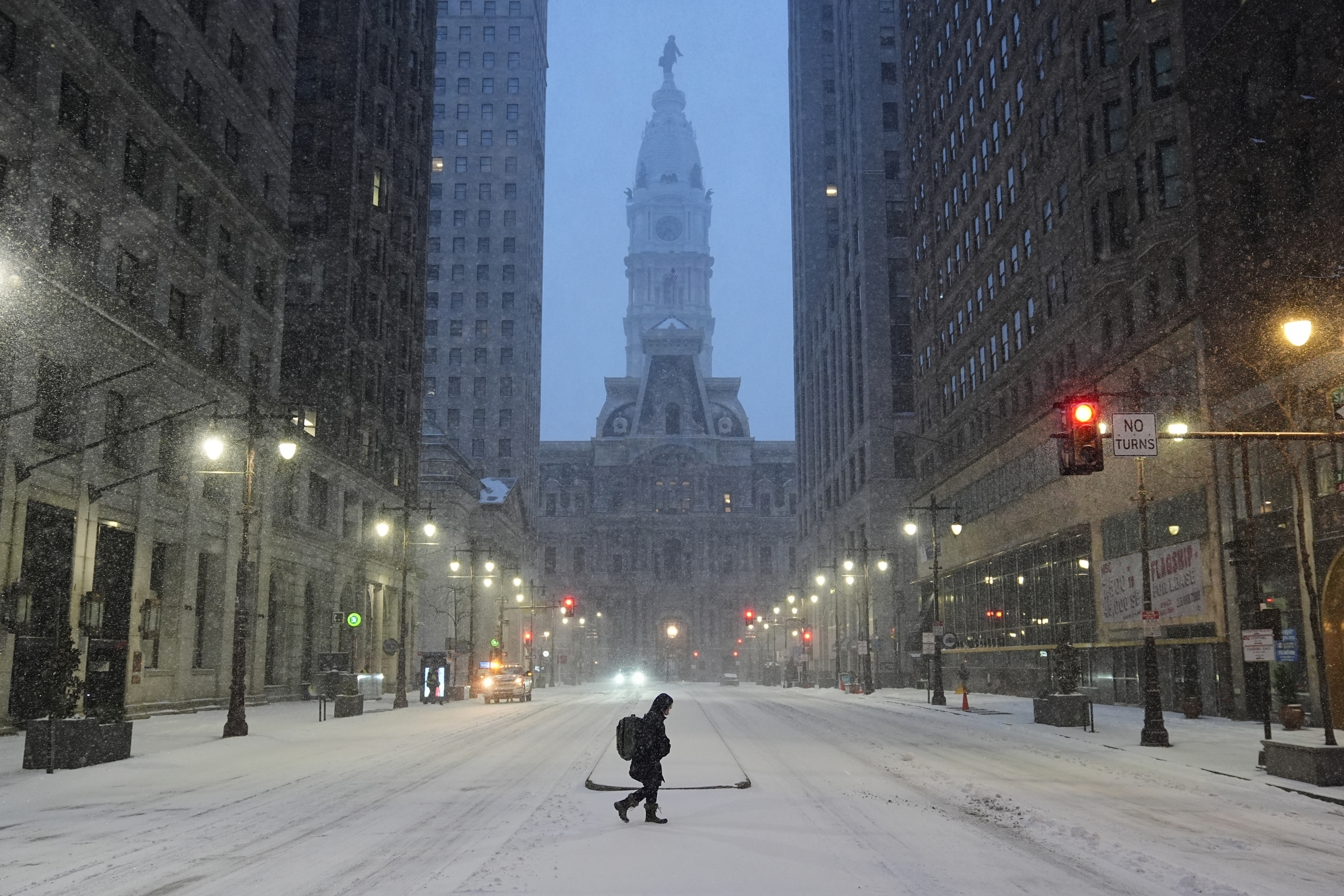 A person walks across a street during a winter storm in Philadelphia on Jan. 25. High winds and frigid weather can lead to dangerous wind chill conditions. (AP)