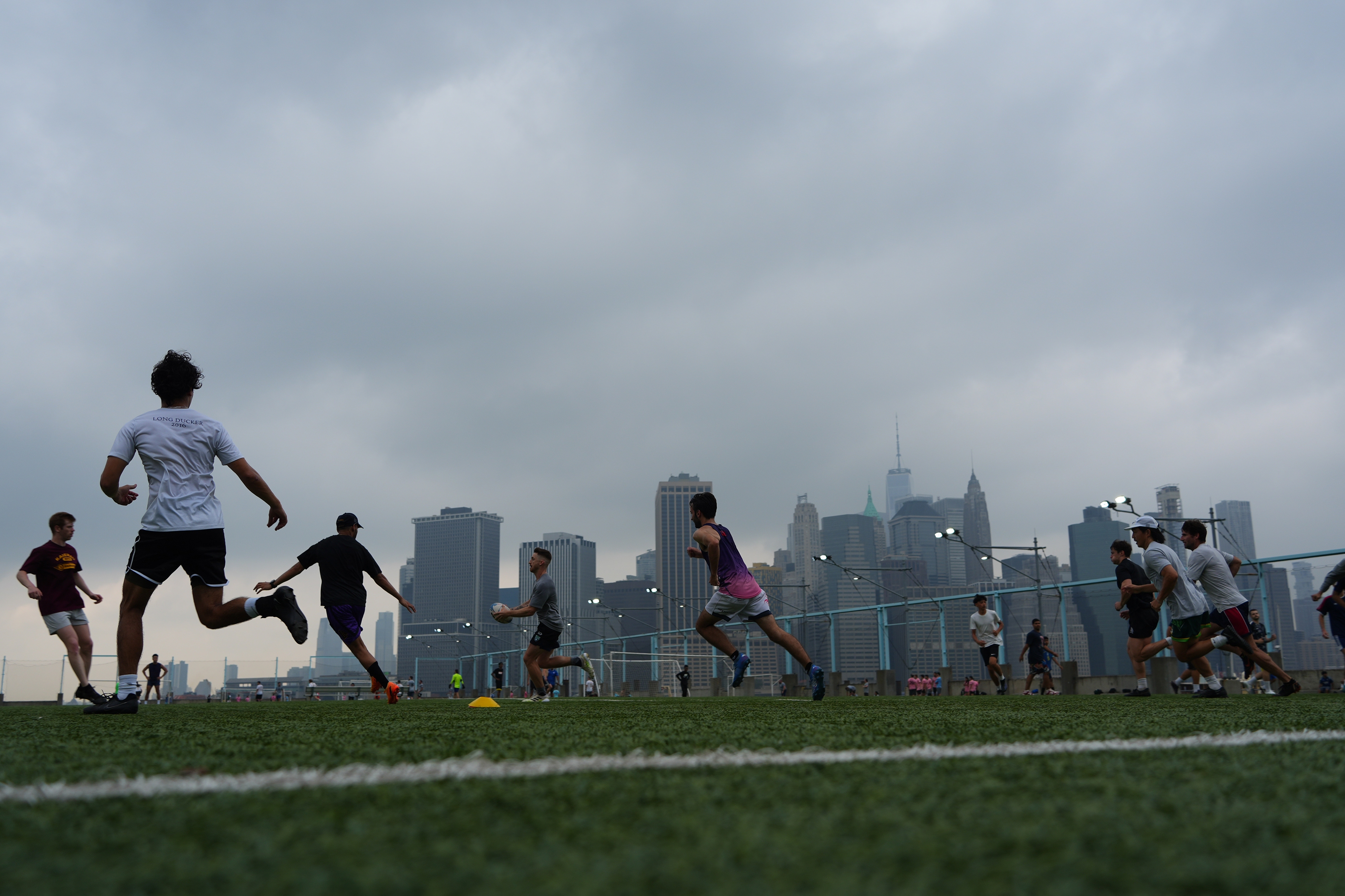 People play rugby in the hazy weather on July 27, 2025 in New York City. There are currently smoke advisories across the Midwest and Northeast as a result of wildfires in Canada.<!-- raw HTML omitted -->