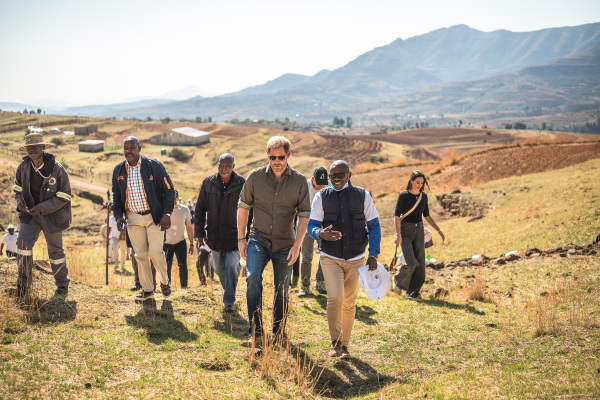 Prince Harry is welcomed by a community leader during a visit of Leribe, Lesotho, on Oct. 2, 2024.