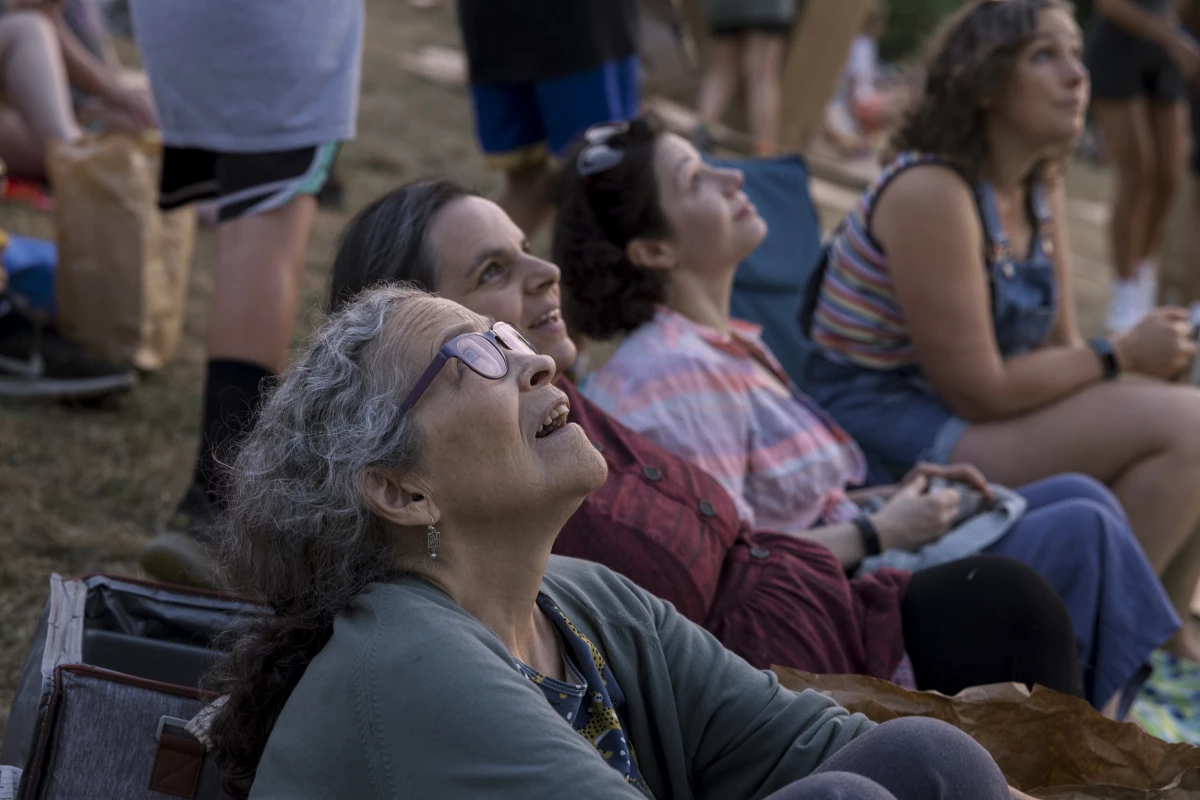 Hester Van Heemstra watches Vaux's swifts swirl in the sky at Chapman Elementary in Portland, Oregon.