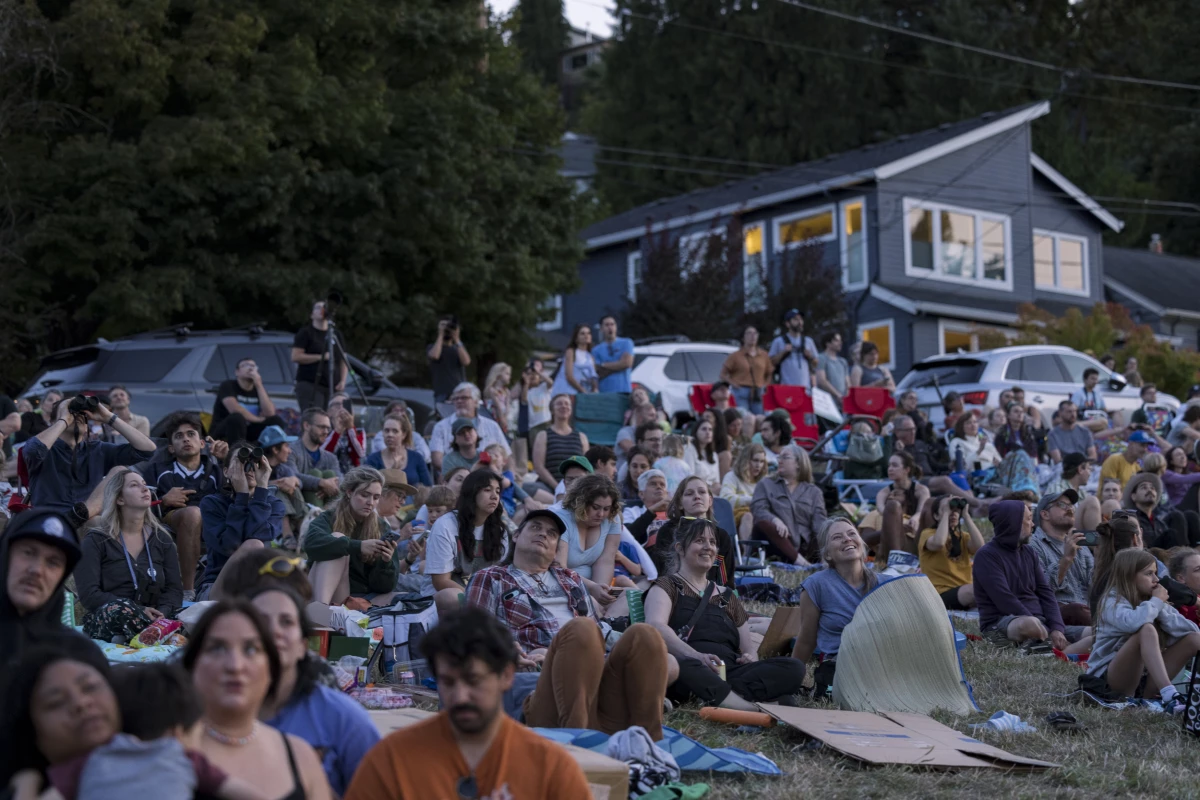 Crowds gather to see migrating Vaux's swifts roosting in the chimney at Chapman Elementary in Portland, Oregon.