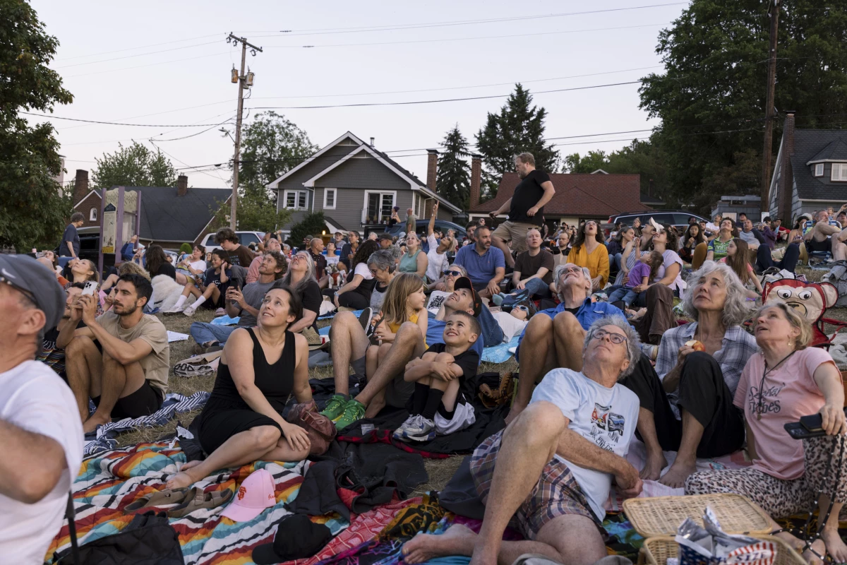 Spectators see the first sighting of Vaux's swifts for the evening at Chapman Elementary in Portland, Oregon on September 8, 2024.