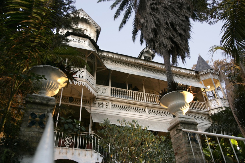 Main entry to the Hotel Oloffson, built as a private residence by Simon Sam in about 1886. U.S. Marines leased it and turned it into a military hospital in the early 20th century. In 1936, Walter Oloffson converted it to a hotel. In the 1950s through the 1970s, it was a Hollywood jet set destination. (Getty Images)
