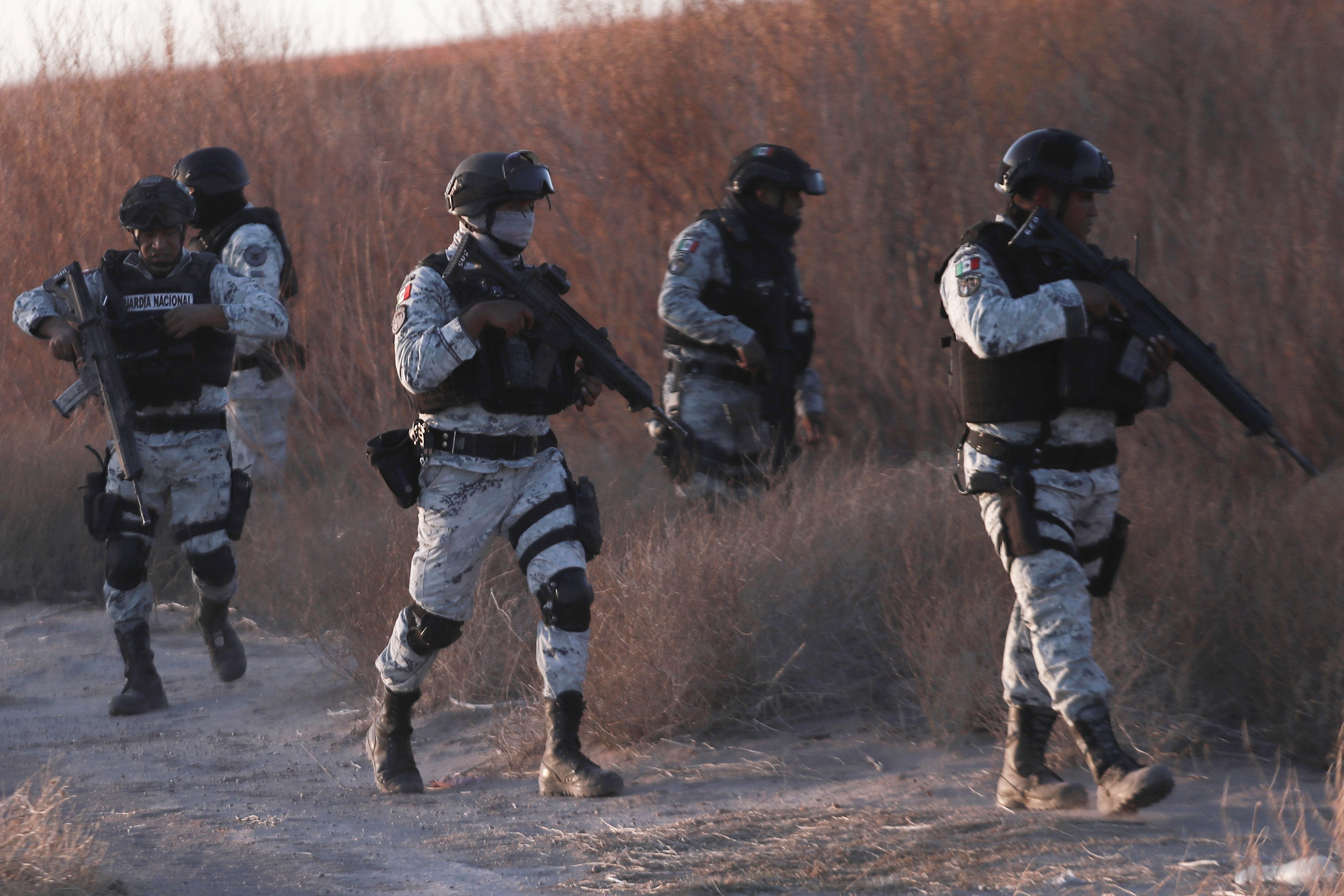 Mexican National Guard members patrol along the Mexico-US border in Ciudad Juarez on Wednesday.