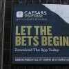 A Caesars Sportsbook gambling advertisement on the exterior of a building in New York City in 2024.