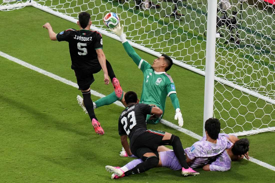Mexico goalkeeper Raul Rangel, middle, reaches to stop the ball during the World Cup Group A soccer match between Mexico and South Korea in Zapopan, near Guadalajara, Mexico, Thursday, June 18, 2026.