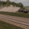 Ukrainian servicemen ride an armored fighting vehicle in the Sumy region, near Ukraine’s northeastern border with Russia on Sunday. Ukrainian troops in this area crossed into western Russia last week and have seized a large swath of territory.