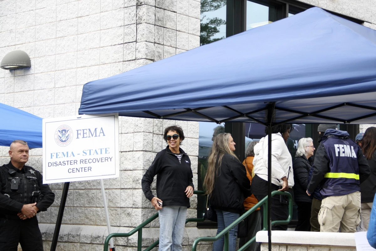 People gather at a FEMA Disaster Recovery Center at A.C. Reynolds High School in Asheville, N.C.,, Tuesday, Oct. 15, 2024.