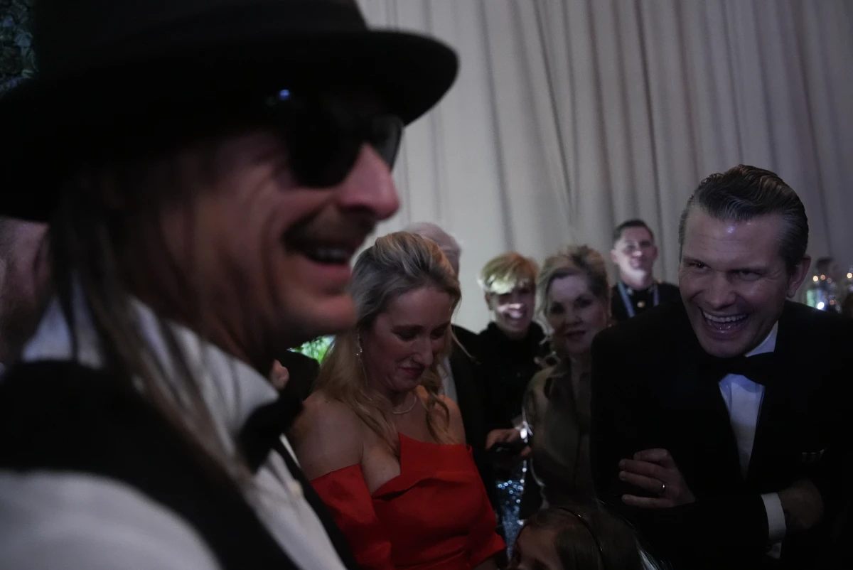 Kid Rock talks with defense secretary nominee Pete Hegseth at the Commander-in-Chief Ball on Monday.