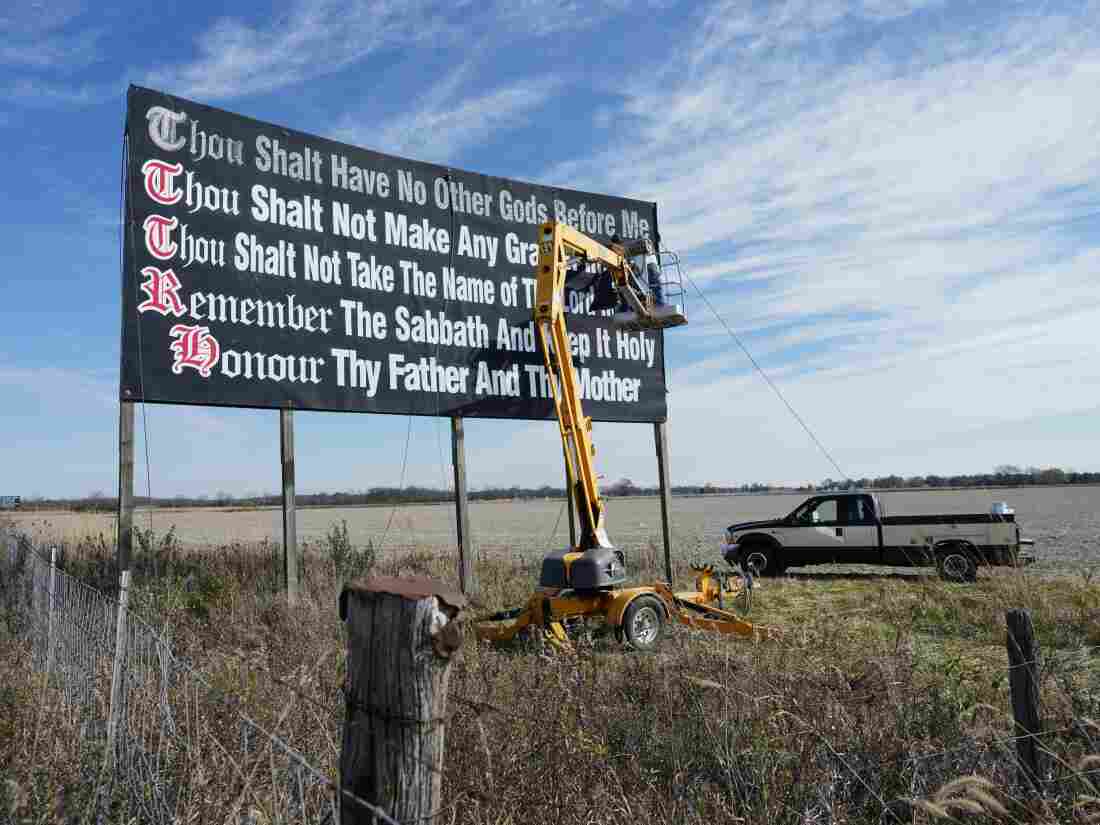 Louisiana has become the first state to require that the Ten Commandments be displayed in every public school classroom under a bill signed into law by Republican Gov. Jeff Landry on Wednesday. Above, workers repaint a Ten Commandments billboard off of Interstate 71 near Chenoweth, Ohio, on Nov. 7, 2023.