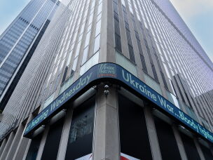 A news ticker displays headlines at the Fox News headquarters in New York City in April 2023.
