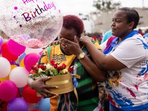 Beka Ntsanwisi (fondly known as Mama Beka) is the local philanthropist who organized the first granny games to help her town's women improve their health. Above: Ntsanwisi (center, wearing the yellow jersey) is given a surprise birthday cake on the last day of the event, when she turned 57.