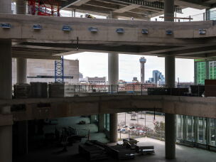 The iconic Reunion Tower is seen through construction of the new Goldman Sachs campus in Dallas. The New York investment bank plans to open the 800,000-square-foot project in 2028, with space to eventually employ more than 5,000 local workers.