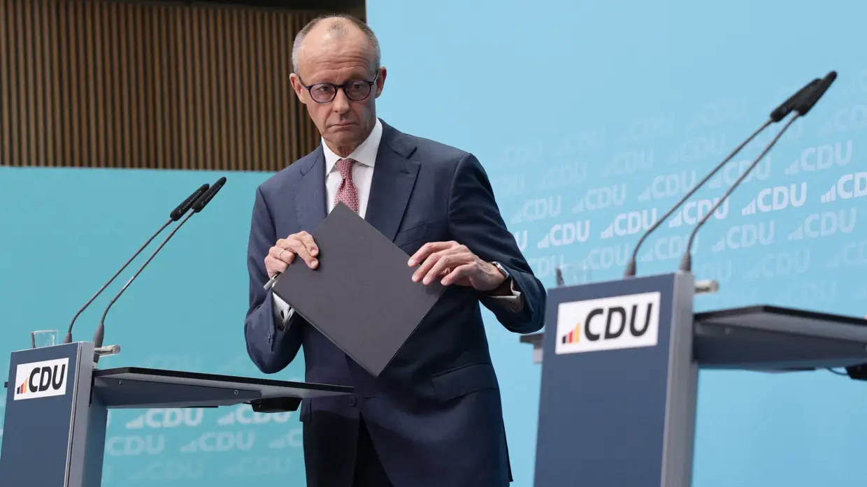 German Chancellor and leader of Germany's center-right Christian Democratic Union Friedrich Merz leaves after a press conference one day after state elections in Berlin and Mecklenburg-Western Pomerania, at the CDU's headquarters in Berlin on Sept. 21.