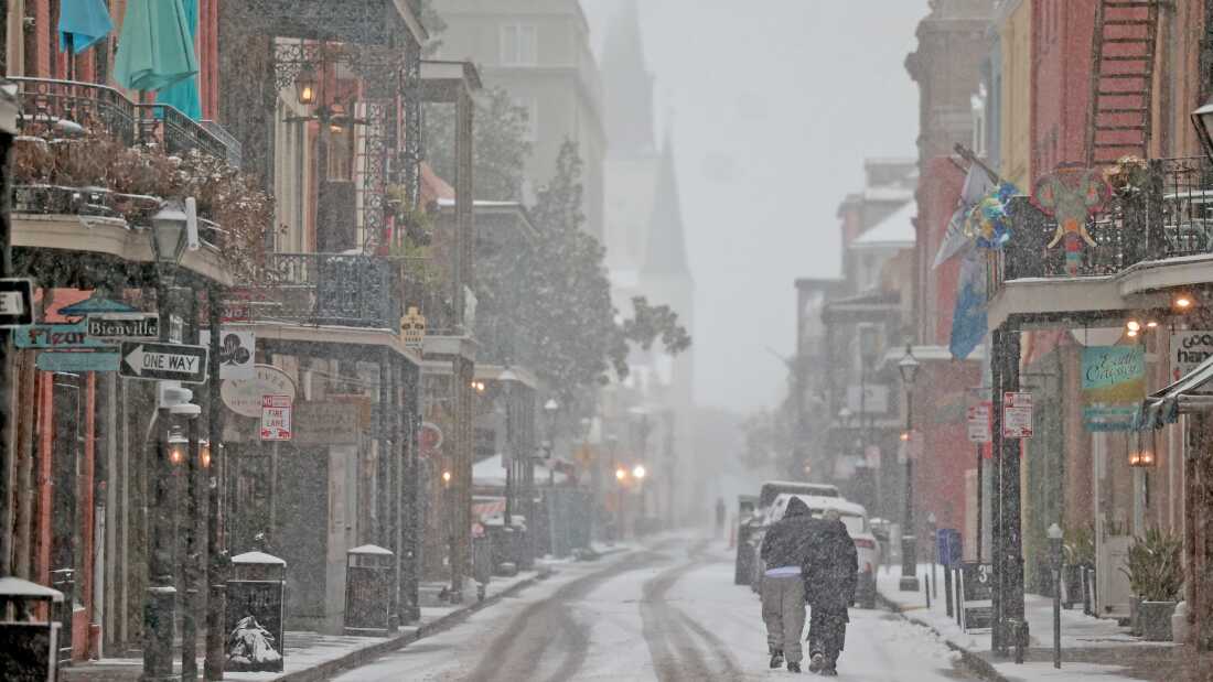 Snow falls on Chartres Street in the French Quarter on Jan. 21, in New Orleans, La.