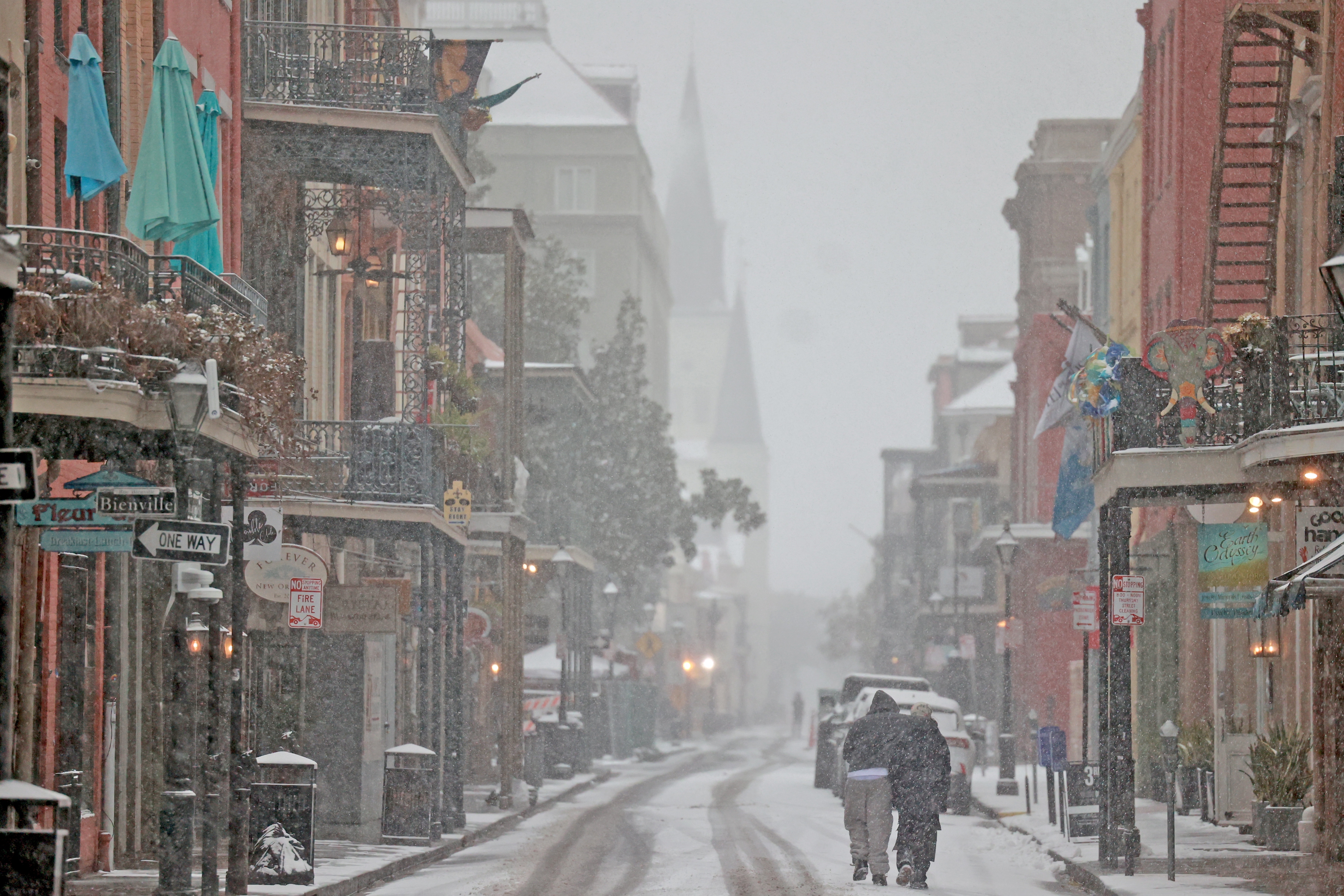 New Orleans, Louisiana: Snow falls on Chartres Street in the French Quarter.